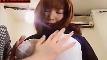 Asian Ladies Engaging In Lesbian Kissing And Titlicking