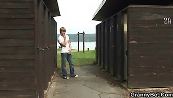 Old Man Engages In Sexual Activity With An Elderly Blonde Woman In A Public Restroom